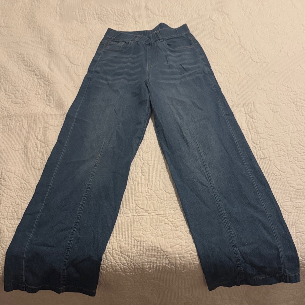 Blue jeans. Elastic waist.  Never worn.  Fit more like a 3/4.